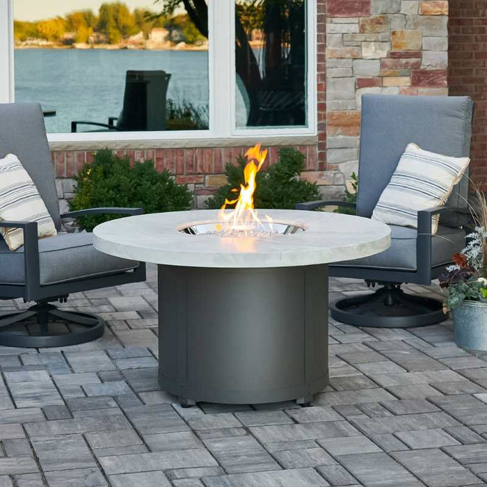 Beacon 48 Round Gas Fire Pit Table White Onyx Place at the Front Yard with Clear Tempered Fire Glass Gems plus Fire Burner On