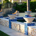 Charleston Fire Bowl - GFRC Concrete 36" Placed in Swimming Pool Area with Cerulean Fire Pebbles V2