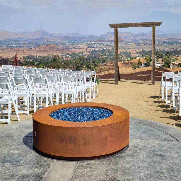 Corten Steel Unity with Cerulean Fire Pebbles place at the center of a Event Place