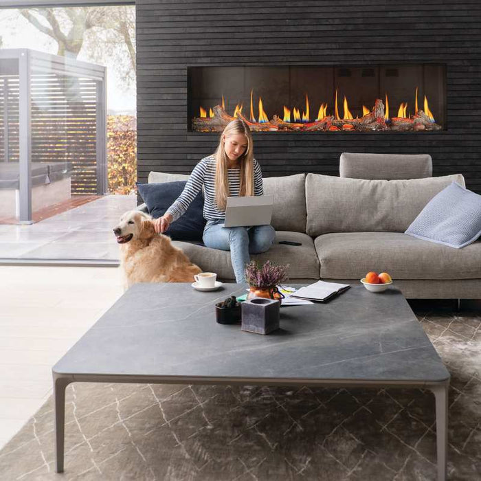 Napoleon Luminex 65 Linear Electric Fireplace plus Beach Fire Logs, Woodland Kit, Amber Orange Top Light, Orange Ember Bed & Orange Gas Flame Pattern installed at the Living room with Woman and Do