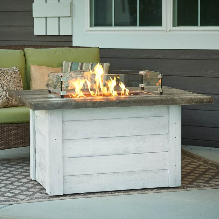 The Outdoor Greatroom Alcott Rectangular Gas Fire Pit Table at the Balcony with Glass Wind Guard Scaled