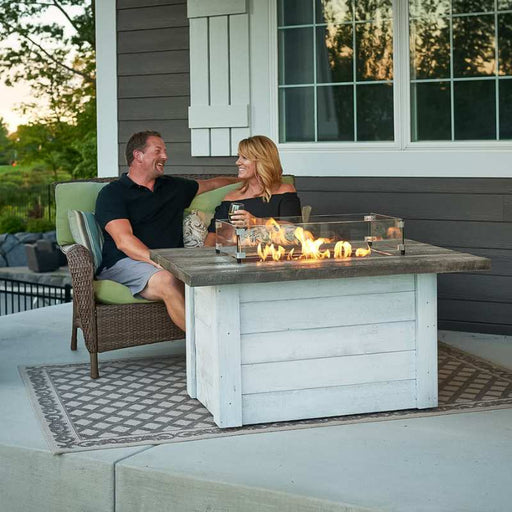 The Outdoor Greatroom Alcott Rectangular Gas Fire Pit Table at the Balcony with Glass Wind Guard v1