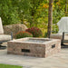 The Outdoor Greatroom Bronson Block Square Gas Fire Pit Kit Installed at Front Yard with Tumbled Lava Rock