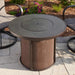 The Outdoor Greatroom Brown Stonefire Round Gas Fire Pit Table  Installed at Front Yard with Composite Burner Cover