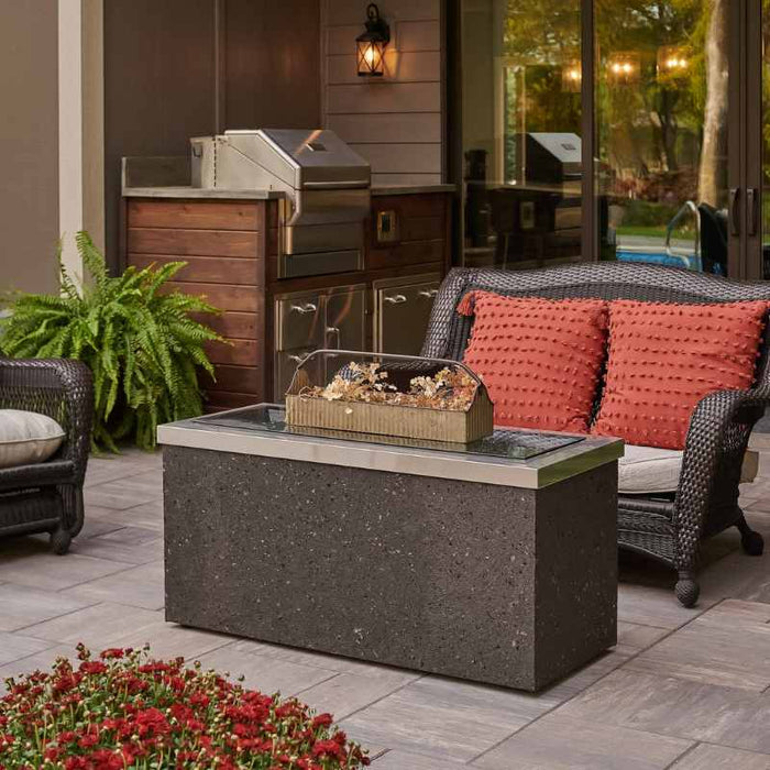 The Outdoor Greatroom Midnight Mist Key Largo Linear Gas Fire Pit Table Placed at the Deck with Grey Glass Burner Cover