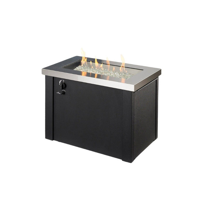 The Outdoor Greatroom Providence Rectangular Gas Fire Pit Table with Clear Tempered Fire Glass Gems with Fire Burner On